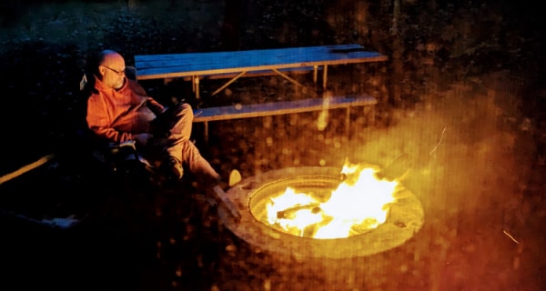 Husband enjoying the campfire.